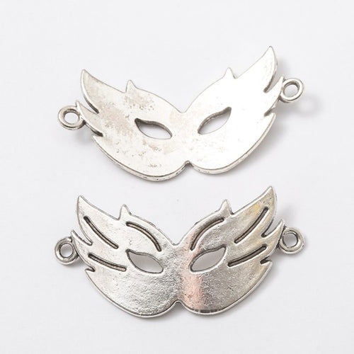 Close view of the an openwork masquerade mask with one loop at each side