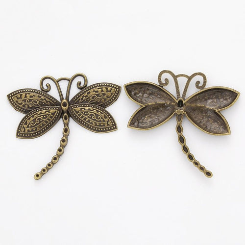 Close front and reverse view of the metal dragonfly charm