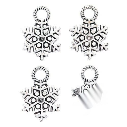 Alternate product view of openwork snowflake charms on a white background