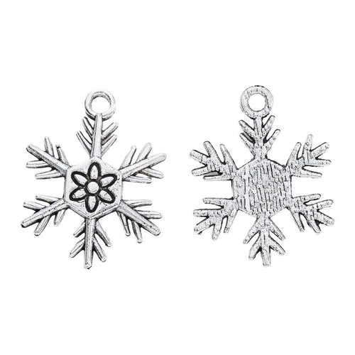 Alternate product view of six-point snowflake charms on a white background