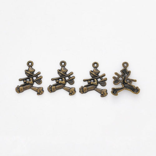 Close front view showing the shape and recessed details of the campfire log charms