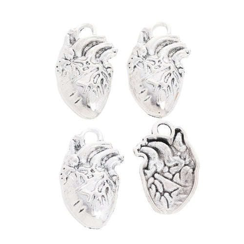 Close view showing the front and reverse details of the anatomical heart charm