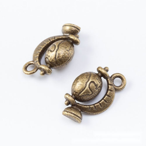 Globe Charm Pendant front detail showing raised continents and a sculpted stand