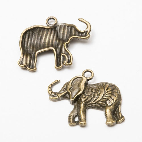 Front and reverse details of the raised trunk elephant metal charm pendant