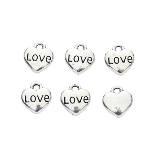Front detail of love engraved heart metal charm
