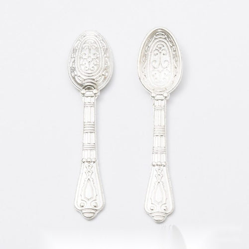 Additional front and reverse view of the long ornate spoon charm