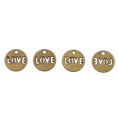 Close view of the round LOVE message charm surface and relief