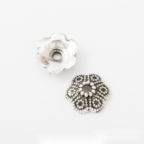 Close view of Floral Bead Cap metal shape and surface detail