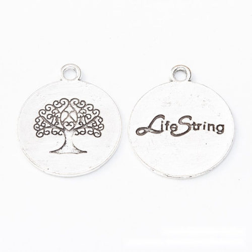 Detailed view of round tree of life medallion metal component