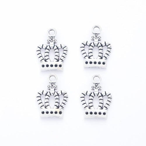 Close-up view of the cutout royal crown metal charms in six finishes showing its front and reverse metal details.