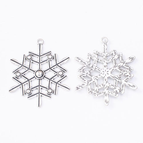 Front and reverse view of the snowflake charm