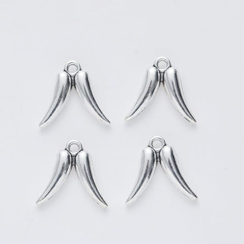 Closer view of the smooth angel wing charm surface and hanging loop