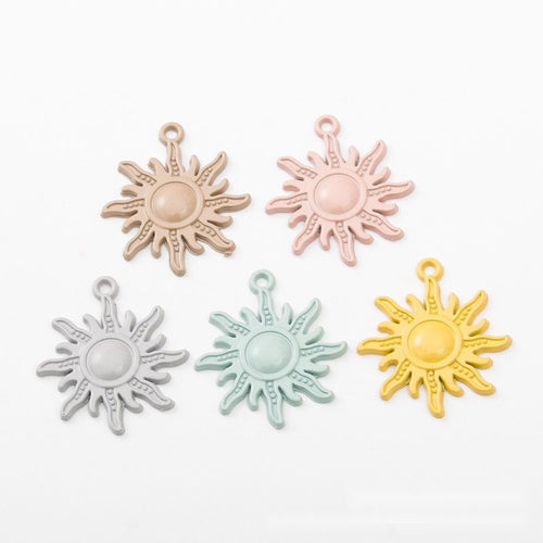 Close view of the a round domed center surrounded by open wavy rays in a matte pastel finish