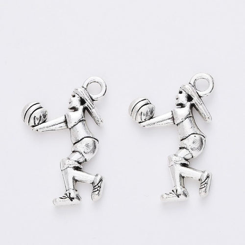 Close front view showing the shape and recessed details of the volleyball girl charms