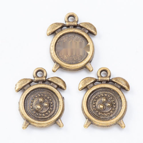 Close view of the a miniature alarm-clock frame with a round recessed setting