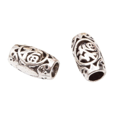 Close view of the a barrel-shaped openwork bead with a large threading hole and Fu character motif