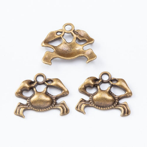 Openwork crab charms with raised claws and curved legs shown from the front on a white background.