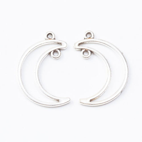 Detail view of crescent moon open bezel showing finish variation 2