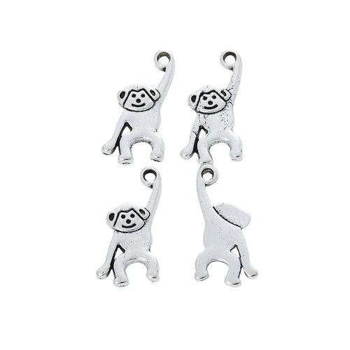 Grouped view of the raised arm monkey metal charm from the front