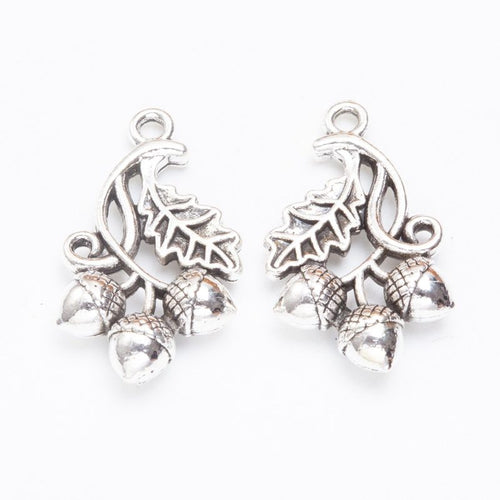 Front detail and finish comparison of the oak leaf and acorn cluster charm
