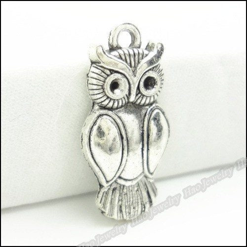 Alternate image of long owl pendant showing available finishes and form