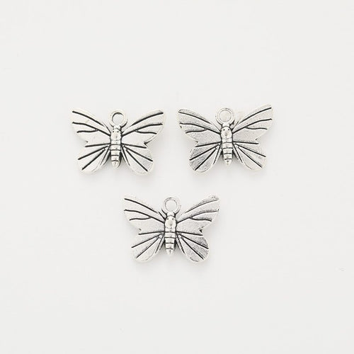 Alternate product view of dragonfly charms on a white background