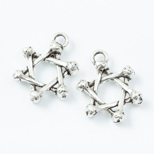 Close product view showing the front and reverse details of the twig star charm