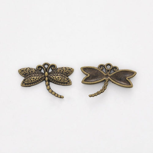 Close front and reverse view of the metal small dragonfly charm