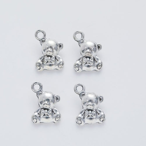 Alternate product view of teddy bear charms on a white background