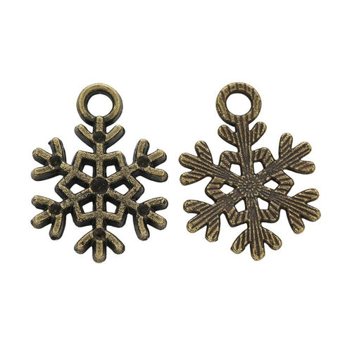 Alternate product view of small snowflake charms on a white background