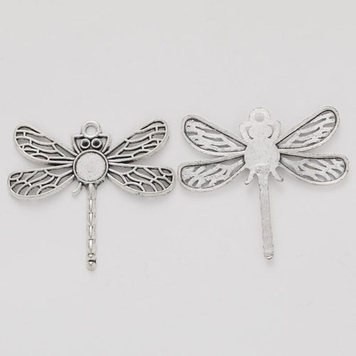 Closer product view of dragonfly connector with round bezel shown against a plain background.