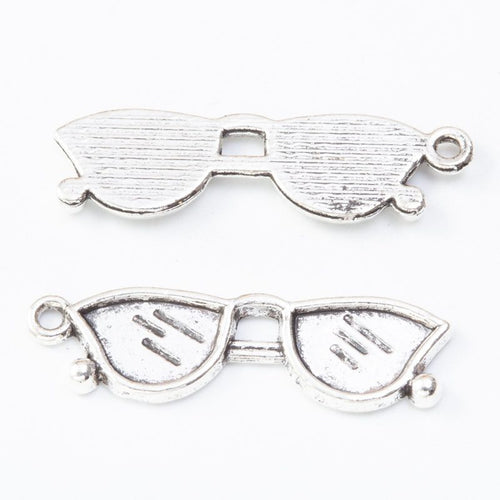 Sunglasses Charm Pendant front detail showing a cat-eye frame with textured lenses