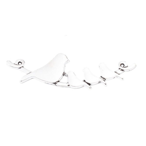 Close product view of the birds on branch double loop connector in two antique finishes