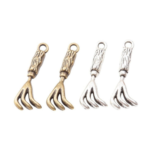Close view of the whisk charm showing its raised front pattern