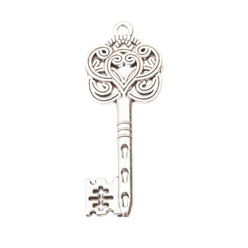 Ornate Key Charm Pendant front detail showing a pierced floral bow and decorative bit