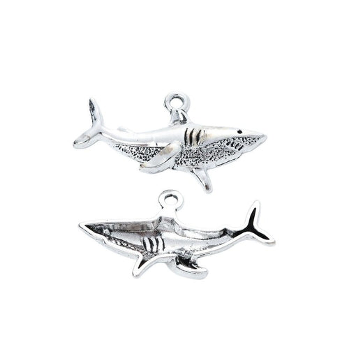 Side-profile shark charm with fins, gill lines, and textured body shown in front detail view