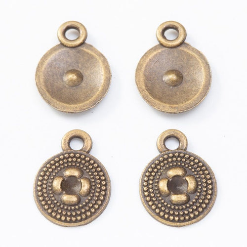 Front and reverse views of the round flower button charm