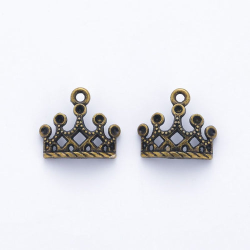 Close view showing the front and reverse details of the cutout crown charms in two sizes