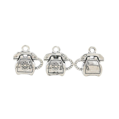 Grouped front and back views showing the details of rotary telephone charms
