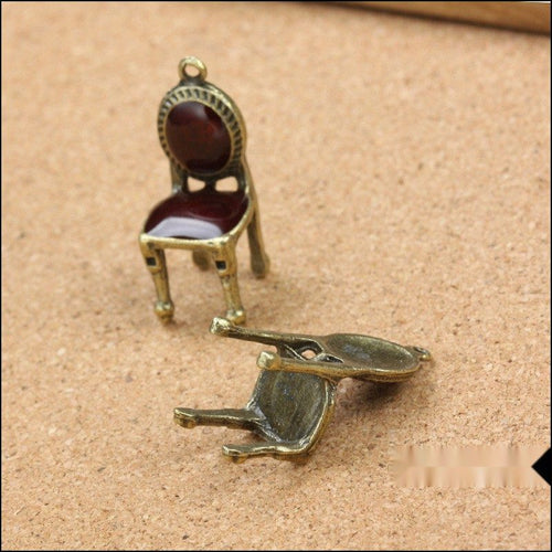 Chair charm shown in front and reverse details