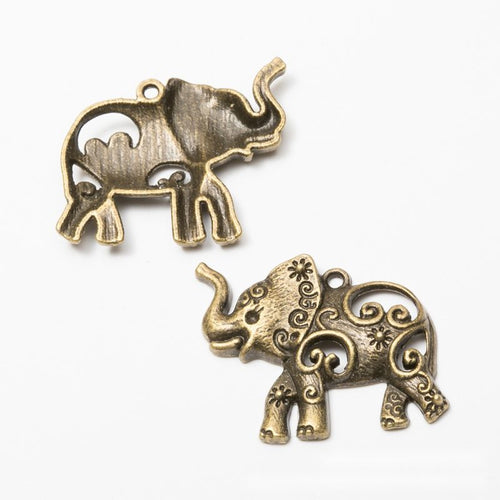 Close view of the an elephant silhouette filled with floral and spiral relief