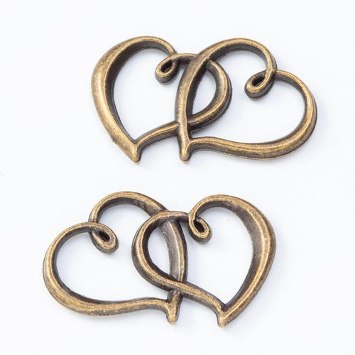 Interlocking Double Heart Charm shown from the front in contrasting finishes
