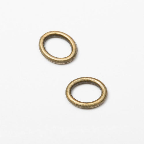 Close view of the a compact oval ring with a smooth raised rim
