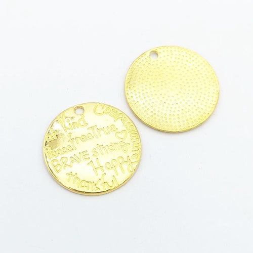 Front detail view of the Kindness Word Art Disc metal piece