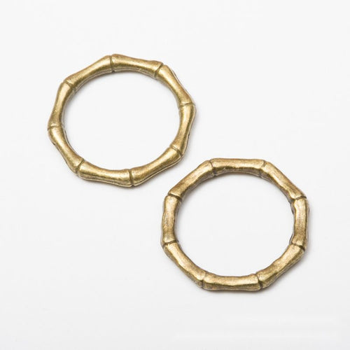 Close product view of the bamboo texture open ring connector in three metallic finishes
