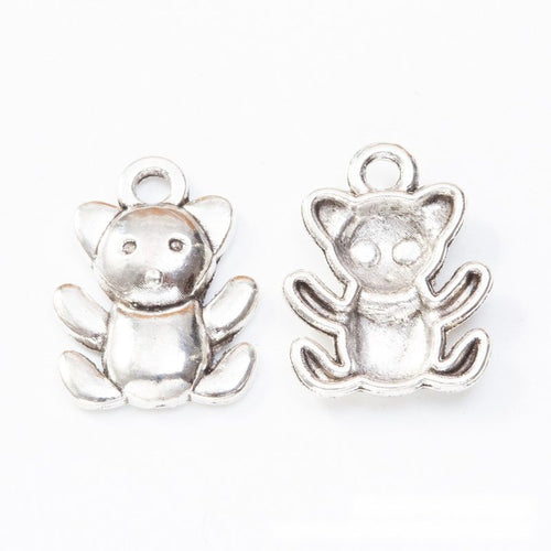 Front and reverse details of koala charms on a white background