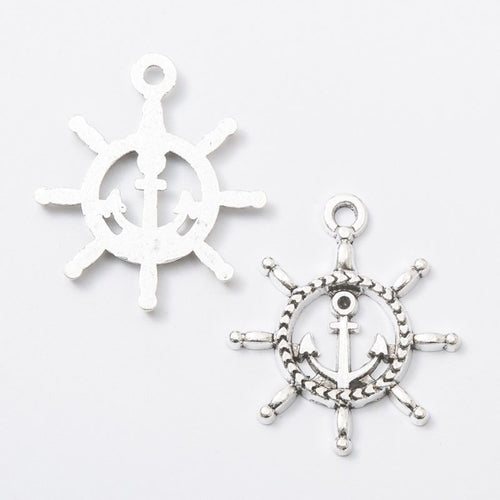 Close front view showing the shape and recessed details of the anchor center ship wheel charms