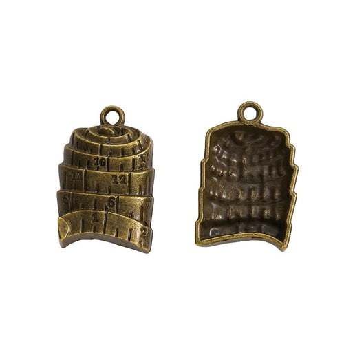 Grouped front and back views showing the details of measuring tape charms