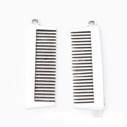 Hairdressing tool metal component, front and reverse detail on white