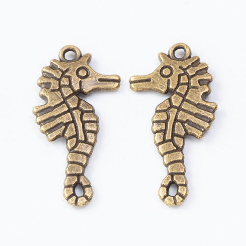 Product photo 2 of the detailed seahorse charm highlighting its curled seahorse silhouette with ridged body details